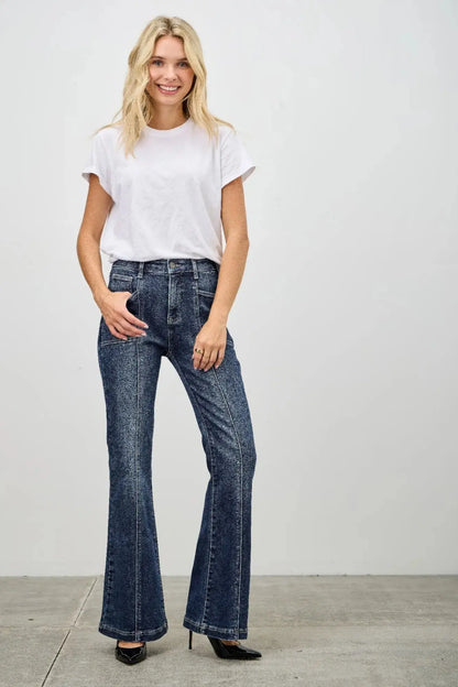 High rise bootcut jeans front view on model posing.