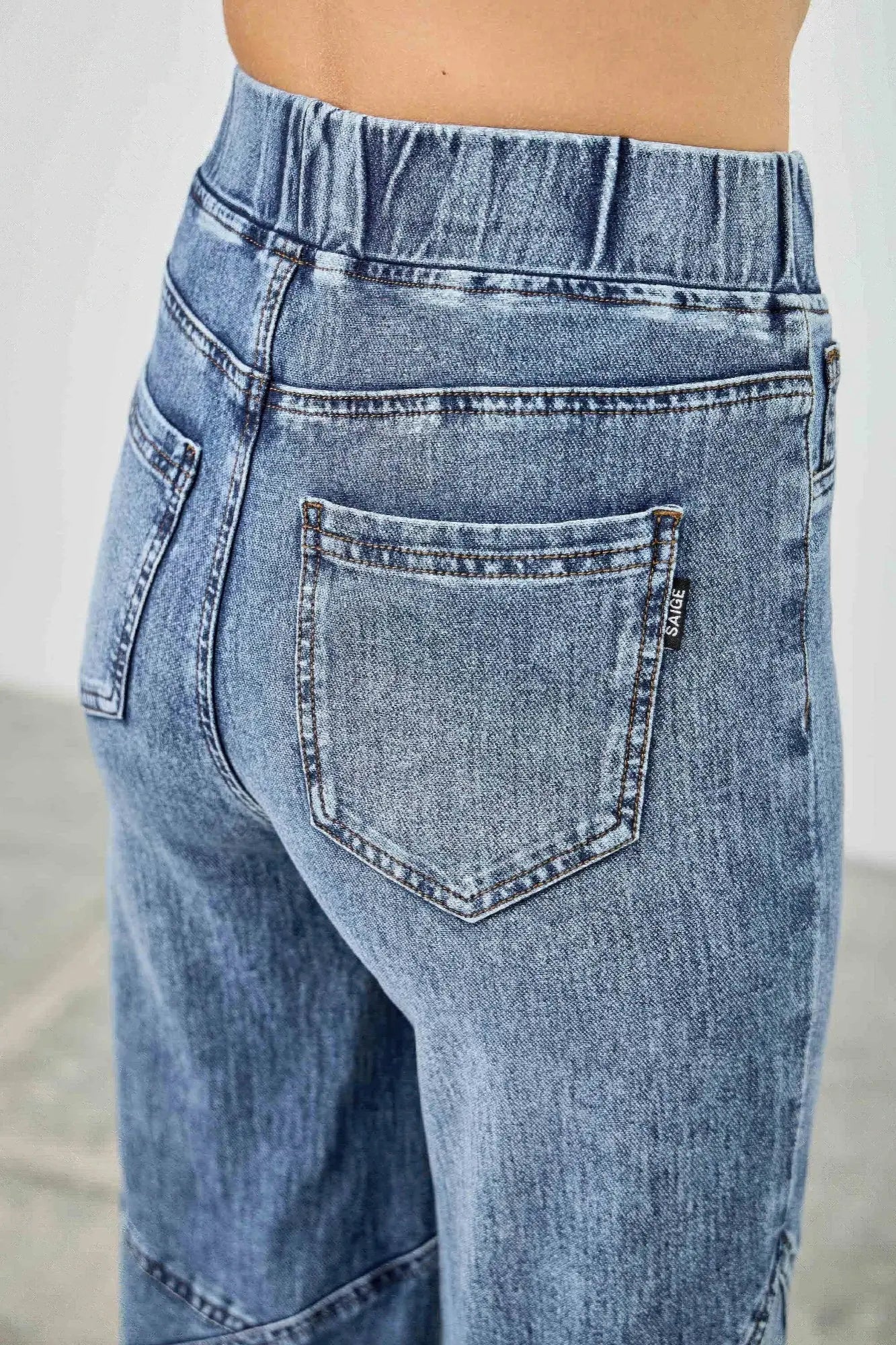 Plus size knit denim jeans with star accents back view