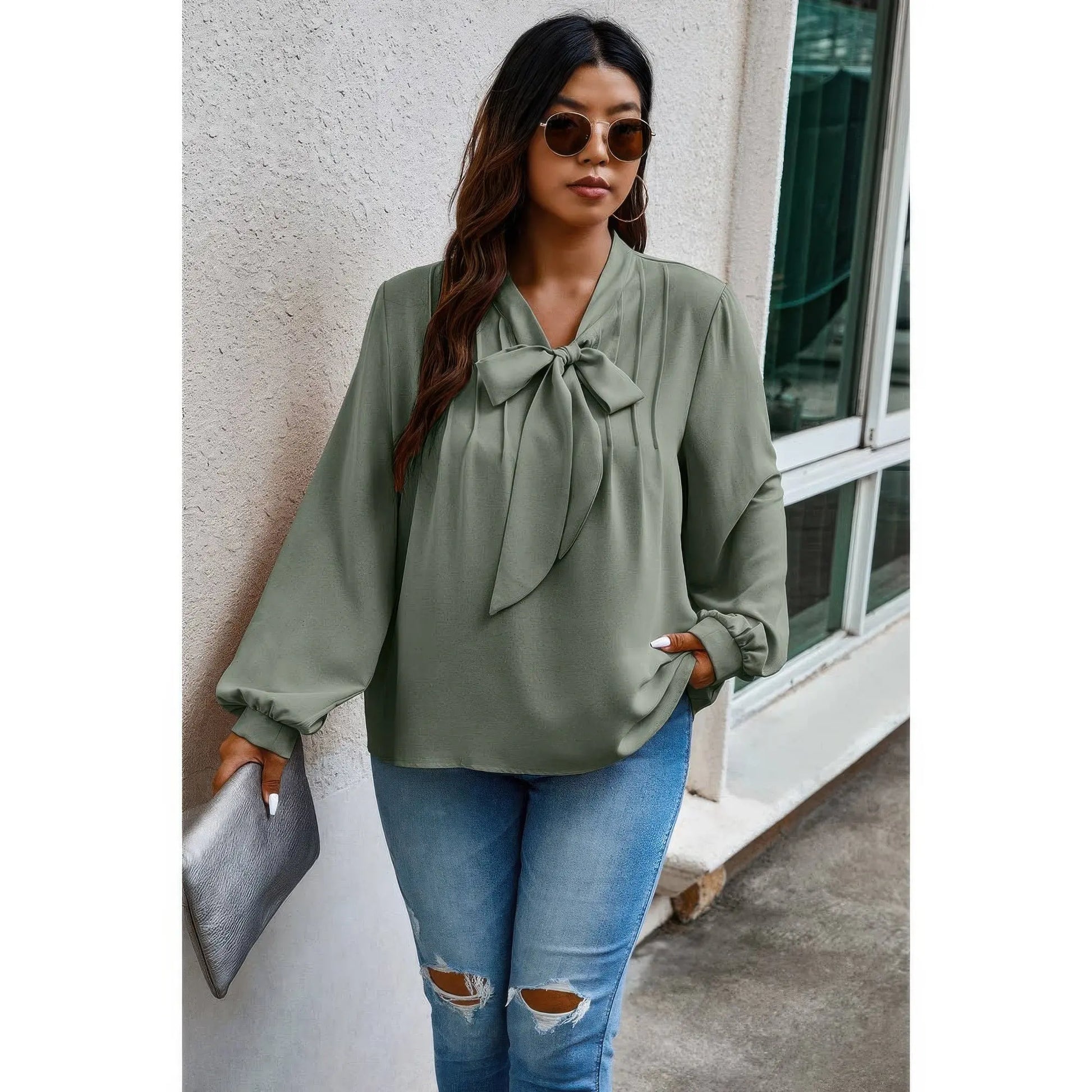 Plus size loose fit ruched knot blouse styled with jeans
