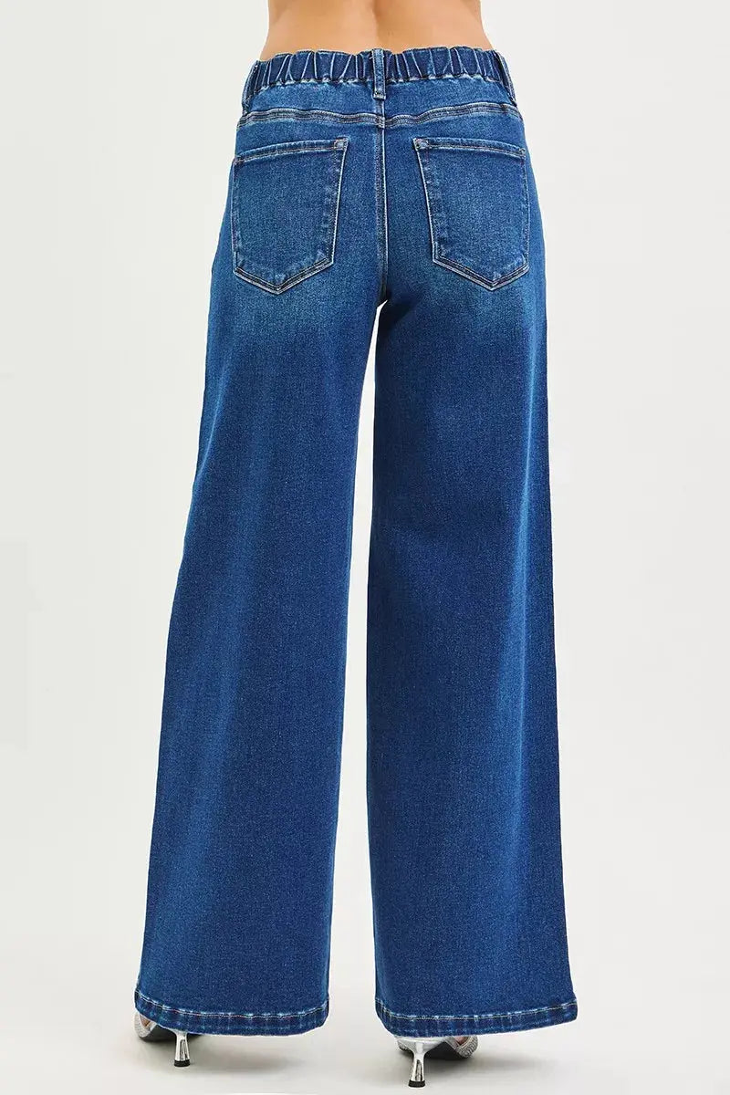 Back view of RISEN mid-rise pintuck jeans on model