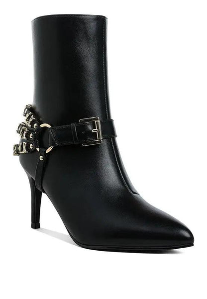 Side view of harness detail stiletto boots in black with pointed toe.