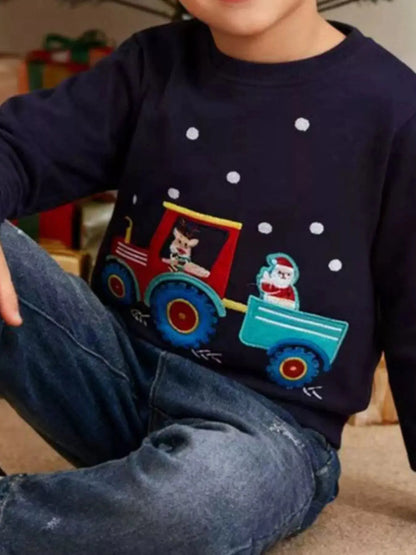 Child wearing navy Christmas embroidered sweatshirt with festive design.