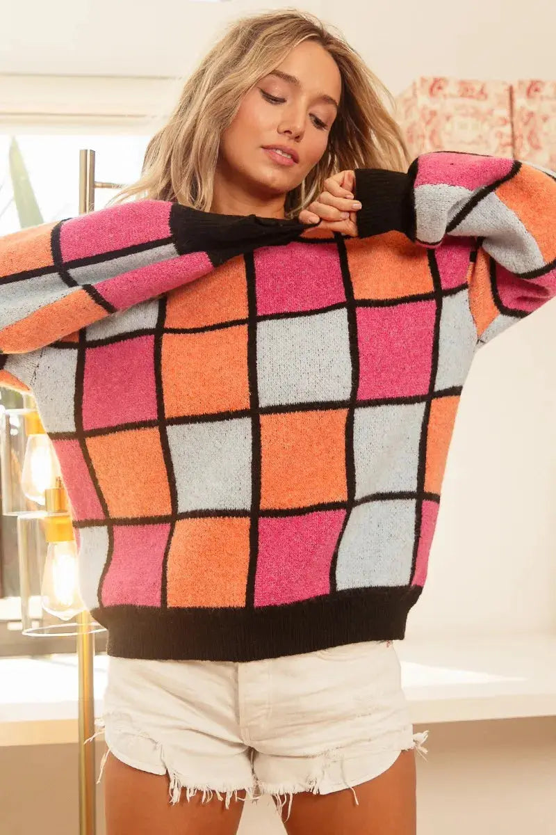 BiBi multi color checker sweater lifestyle pose - female model