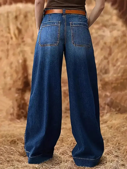 Close-up of high waist and pockets on denim jeans.