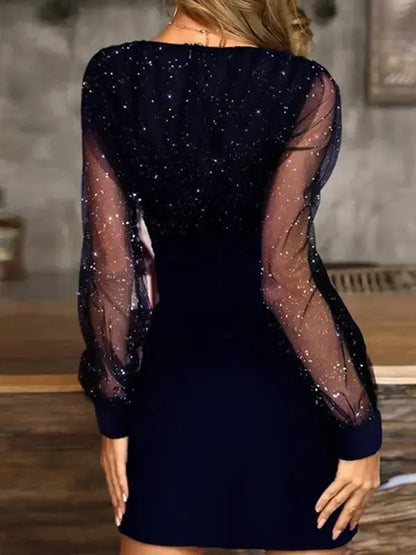 Black sequin bodycon dress with sheer sleeves on model - back view