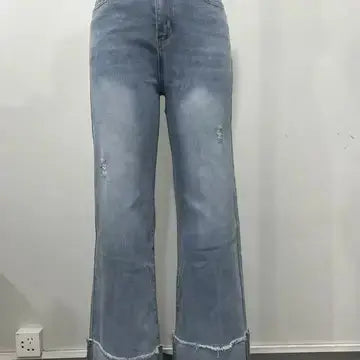 Close up view of back view of cuffed hem straight leg jeans