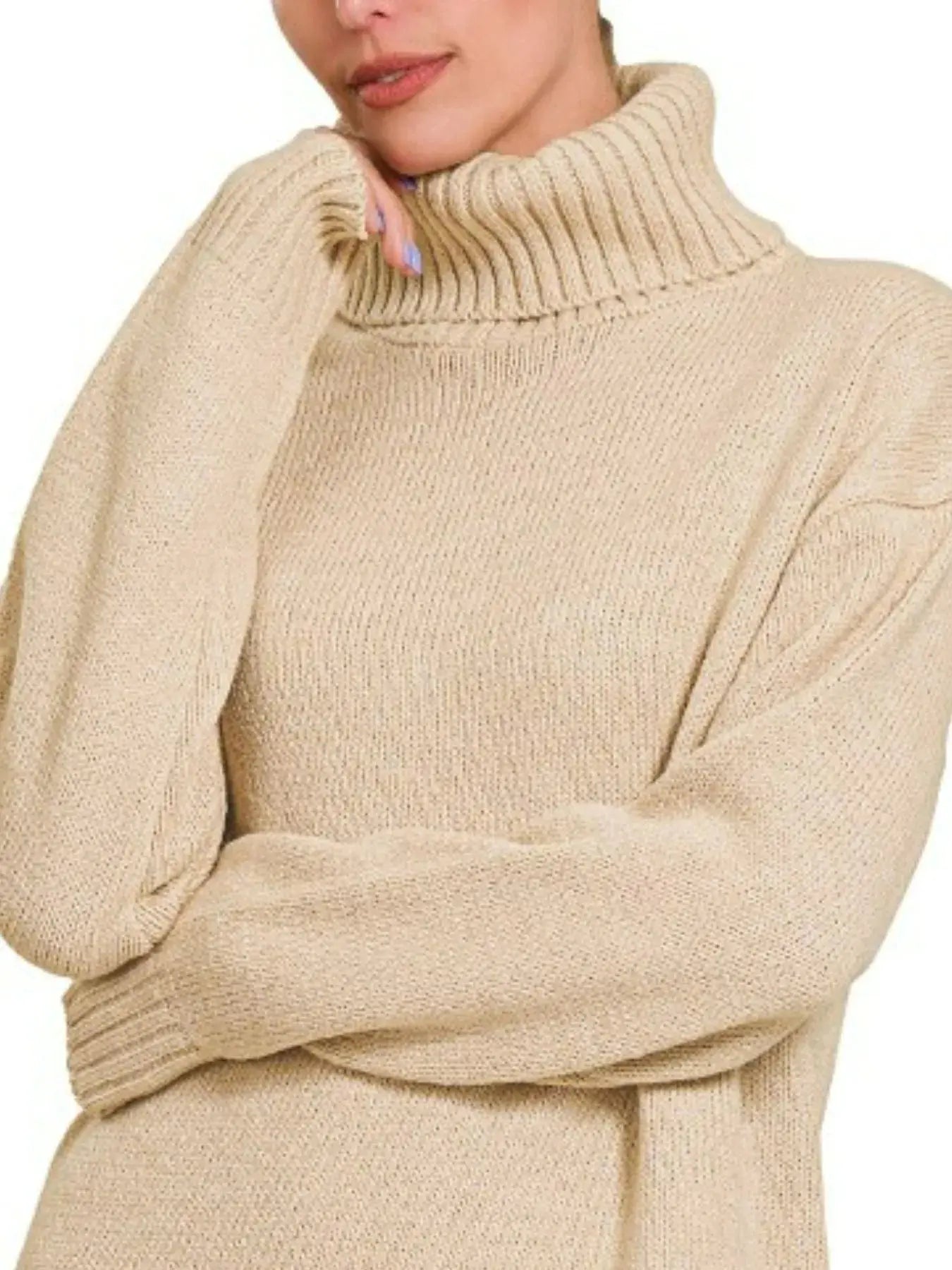 Close-up of ribbed knit texture on beige turtleneck midi sweater dress.