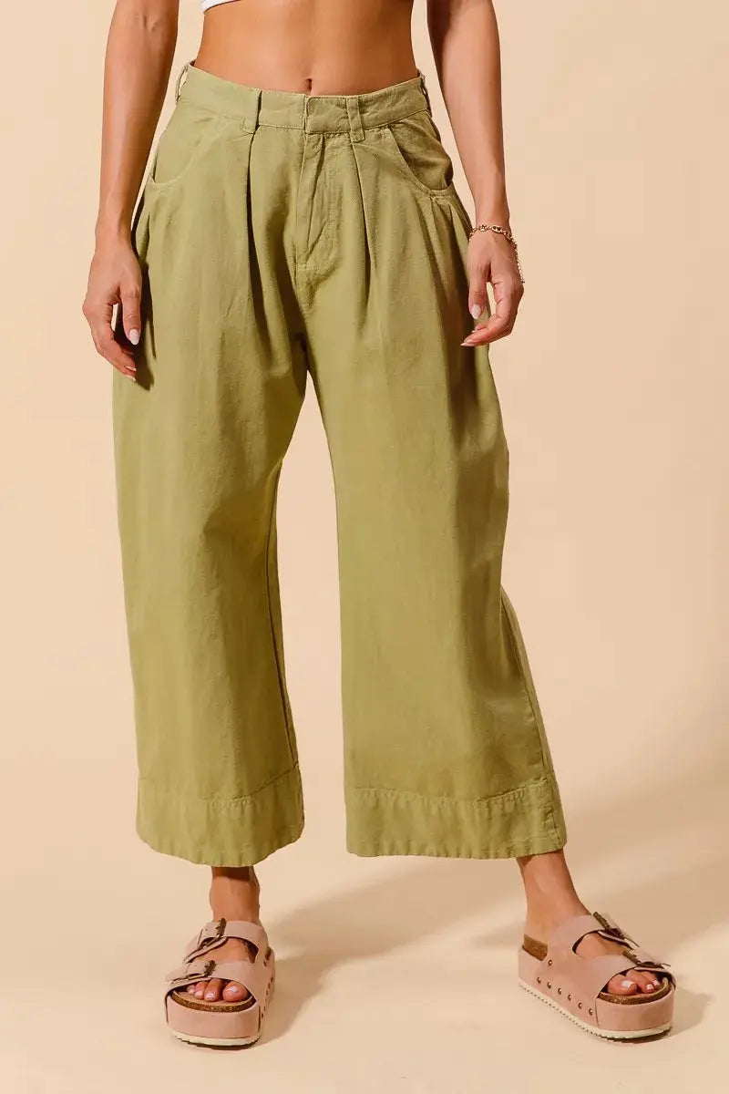 Model wearing olive green wide leg chino pants full front view