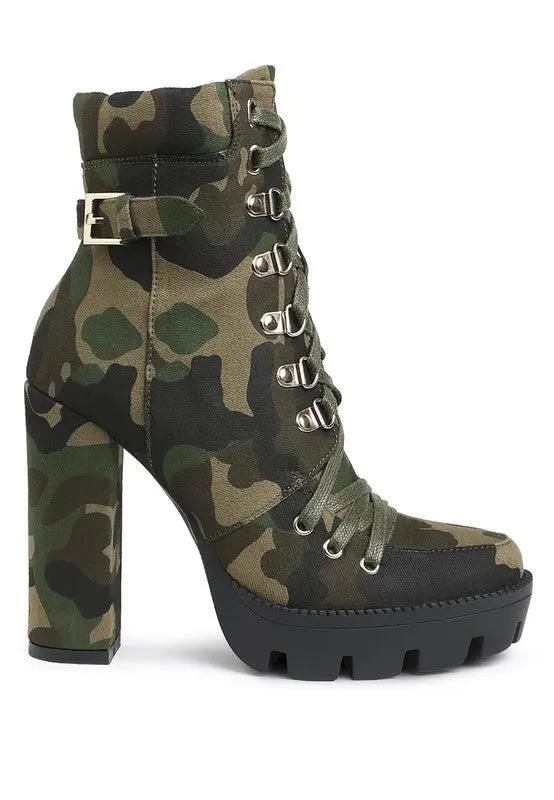 Side view of camouflage lace-up ankle boots with block heel and buckle detail.
