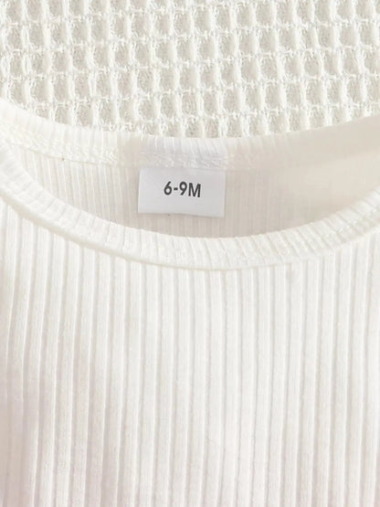 Close up detail of white shirt showing size.